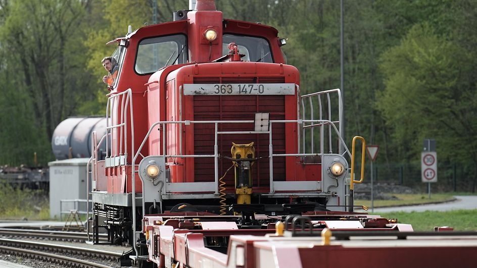 Worker looking out of a locomotive